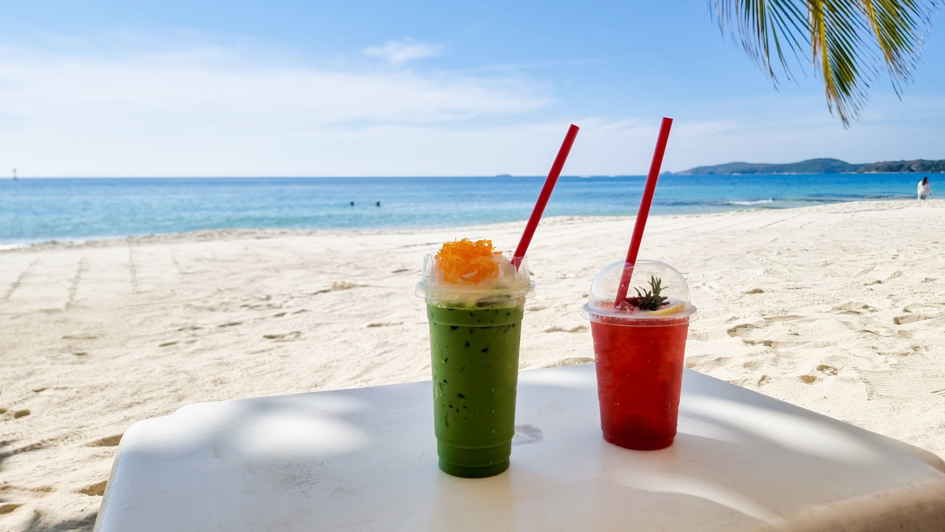 Cold green tea and strawberry shake tropical drinks on the beach of Koh Samet Island Rayong Thailand