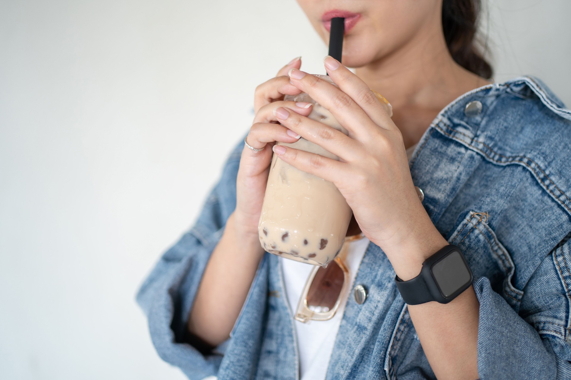 Asian woman drinking iced bubble milk teaAsian woman drinking iced bubble milk tea