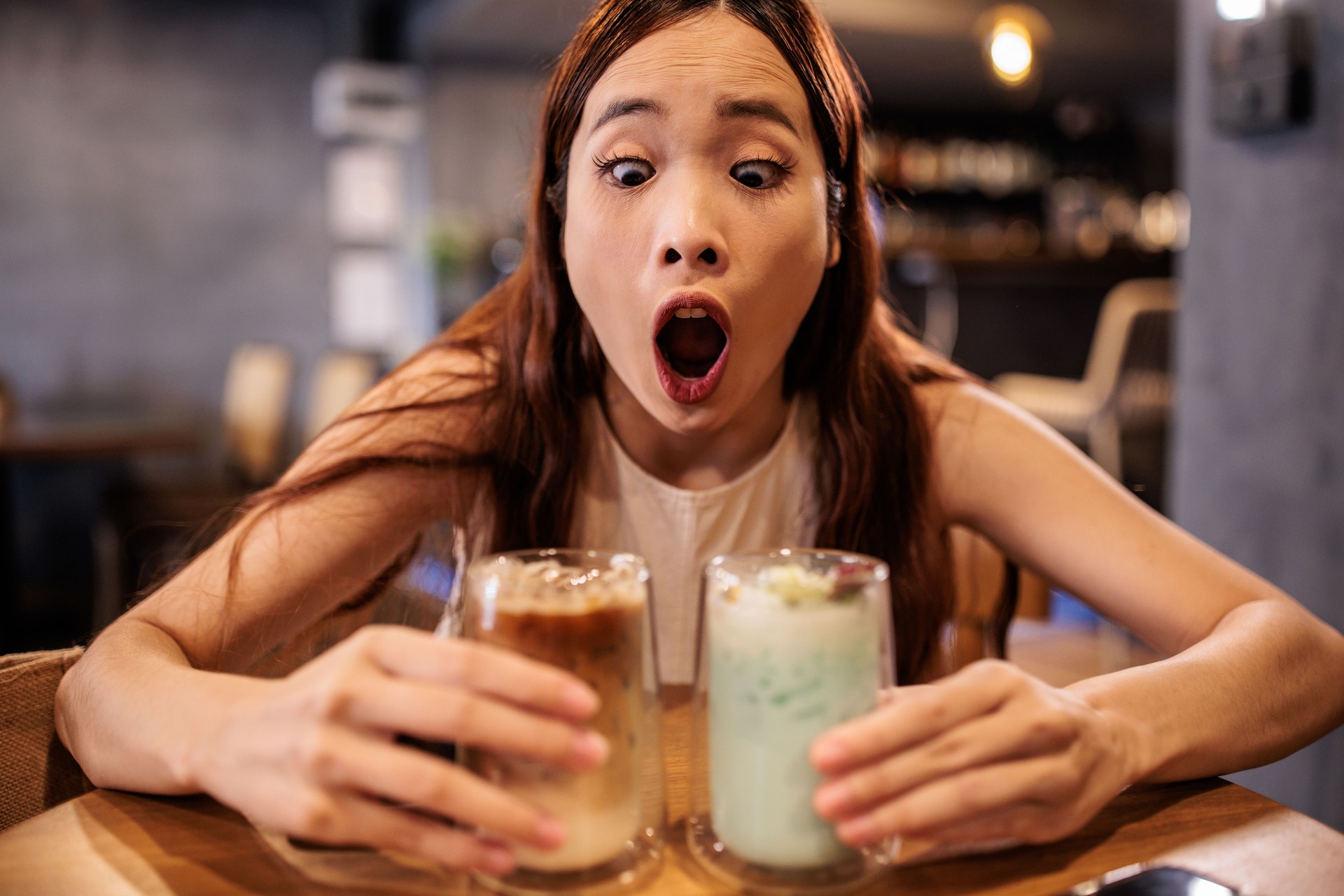 Woman is Excited About Iced Latte